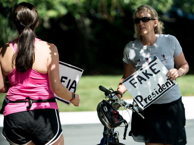 Juli Briskman continues to Donald Trump as he departs the Trump National Golf Club in Sterling, Virginia. Picture: Brendan Smialowski / AFP