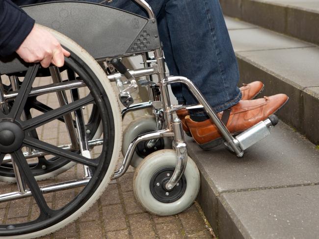 Man in wheelchair after acident at work. Worker suffering from an illness. Cairns Community Legal Centre. Disability Action Week feature