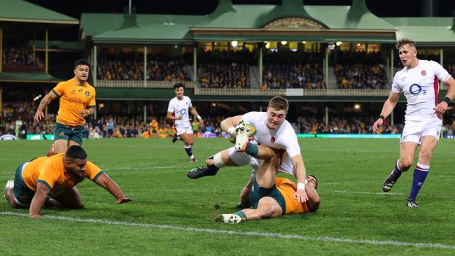 Tom Wright of the Wallabies stops Tommy Freeman in front of the try line. Photo by Mark Kolbe/Getty Images