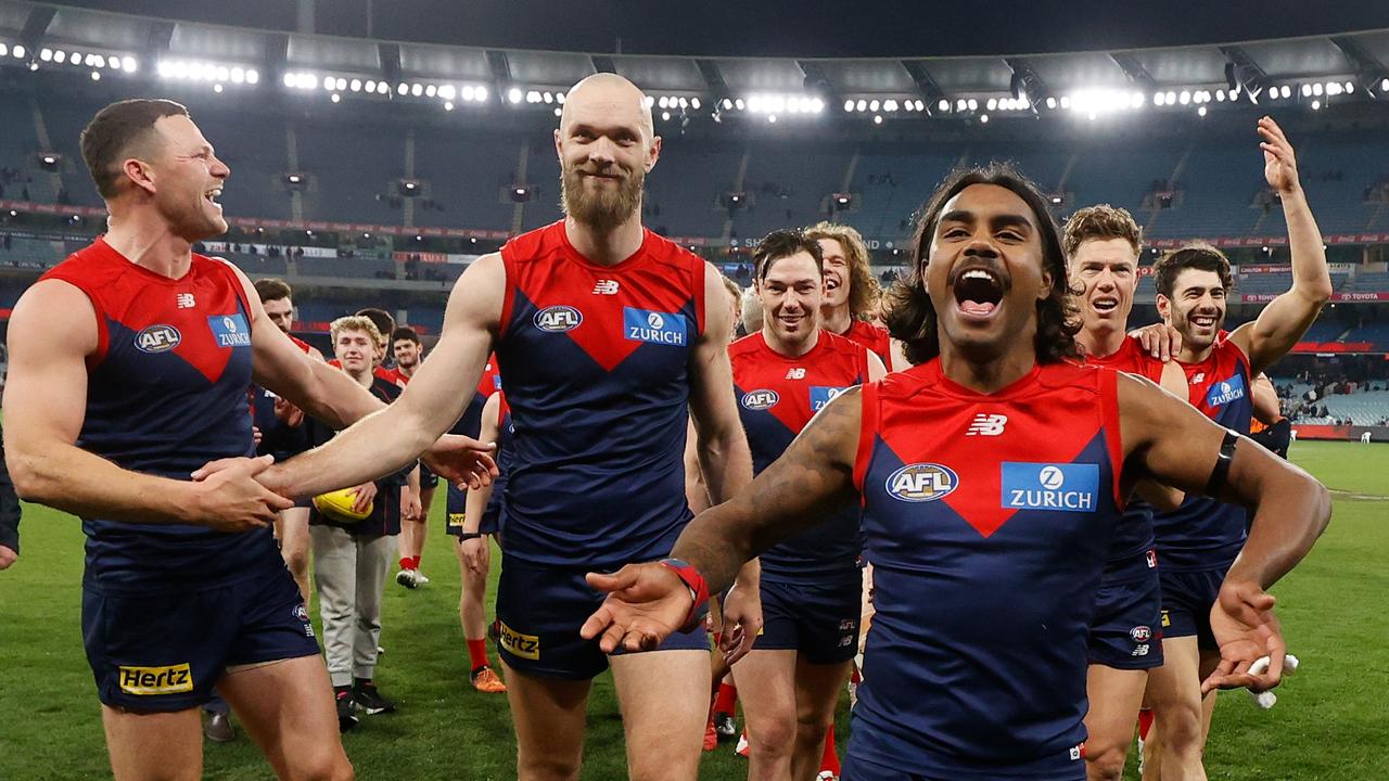 The hero Kysaiah Pickett, right, leads the Demons off the ground. Picture: Michael Willson/AFL Photos