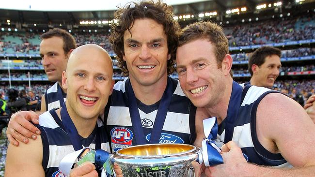 Matthew Scarlett with premiership teammates Gary Ablett and Steve Johnson, who he didn’t have the best relationship at first.