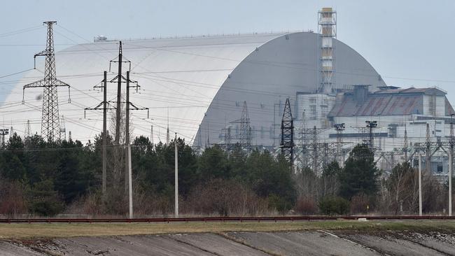 (FILES) A file picture taken on April 13, 2021 shows the giant protective dome built over the sarcophagus covering the destroyed fourth reactor of the Chernobyl Nuclear Power Plant ahead of the upcoming 35th anniversary of the Chernobyl nuclear disaster. - Ukraine's Chernobyl nuclear plant says 'completely halted' over Russian offensive. (Photo by Sergei SUPINSKY / AFP)