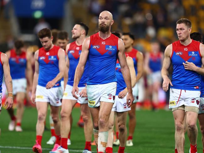 BRISBANE, AUSTRALIA - JUNE 28: Max Gawn and the Demons leave the field after the round 16 AFL match between Brisbane Lions and Melbourne Demons at The Gabba, on June 28, 2024, in Brisbane, Australia. (Photo by Chris Hyde/AFL Photos/via Getty Images)