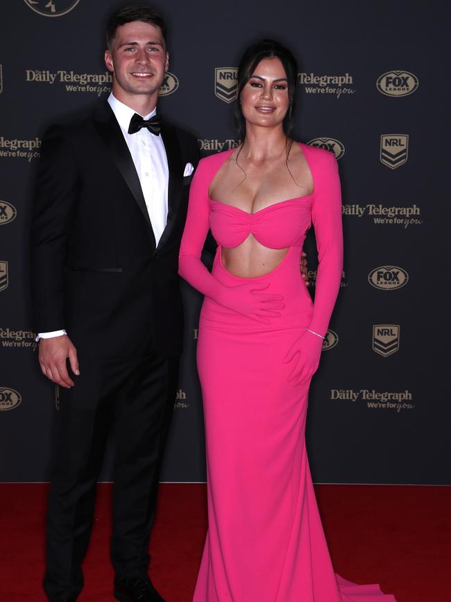 Lachlan Ilias of the Rabbitohs and his partner in hot pink. Picture: Jason McCawley/Getty Images