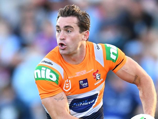 BRISBANE, AUSTRALIA - AUGUST 15:  Connor Watson of the Knights runs the ball during the round 22 NRL match between the Cronulla Sharks and the Newcastle Knights at Moreton Daily Stadium, on August 15, 2021, in Brisbane, Australia. (Photo by Albert Perez/Getty Images)