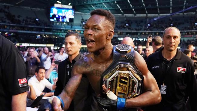 Israel Adesanya celebrates his win against Robert Whittaker. (AAP Image/Michael Dodge)