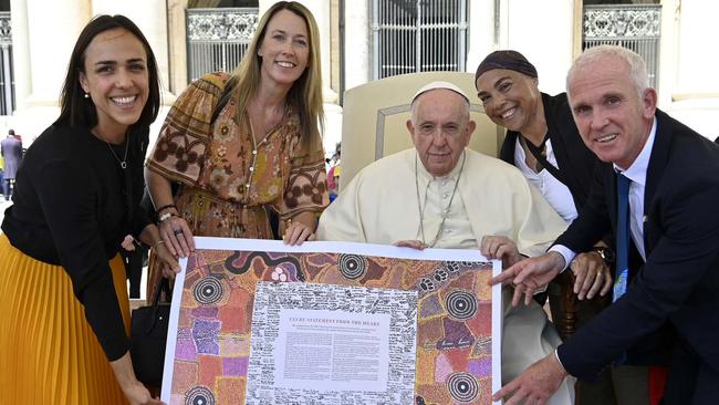 Pope Francis is presented with a copy of the Uluru Statement at the Vatican in May 2022. Picture: Vatican Media