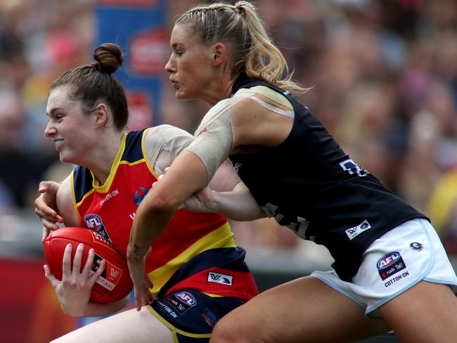 Crows defender Sarah Allan is tackled by Carlton’s star player Tayla Harris during the 2019 AFLW grand final at Adelaide Oval. Picture: AAP/Kelly Barnes