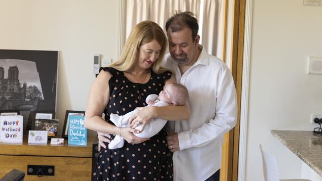 Kelly and Chris with baby Max at home. Picture: Mark Cranitch