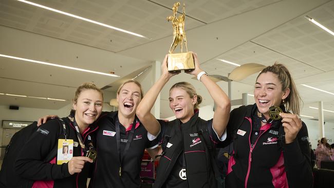 Georgie Horjus, Hannah Petty, Tippah Dwan, and Matilda Garrett from the Thunderbirds returning home at Adelaide Airport, after winning the national title. Picture: Matt Loxton