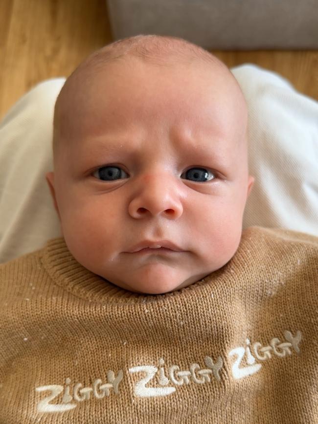 Colby. Eight weeks old. Colby loves a cuddle with his big brothers and has the biggest blue eyes. Colby is such a happy baby and loves cuddles from his older brothers.