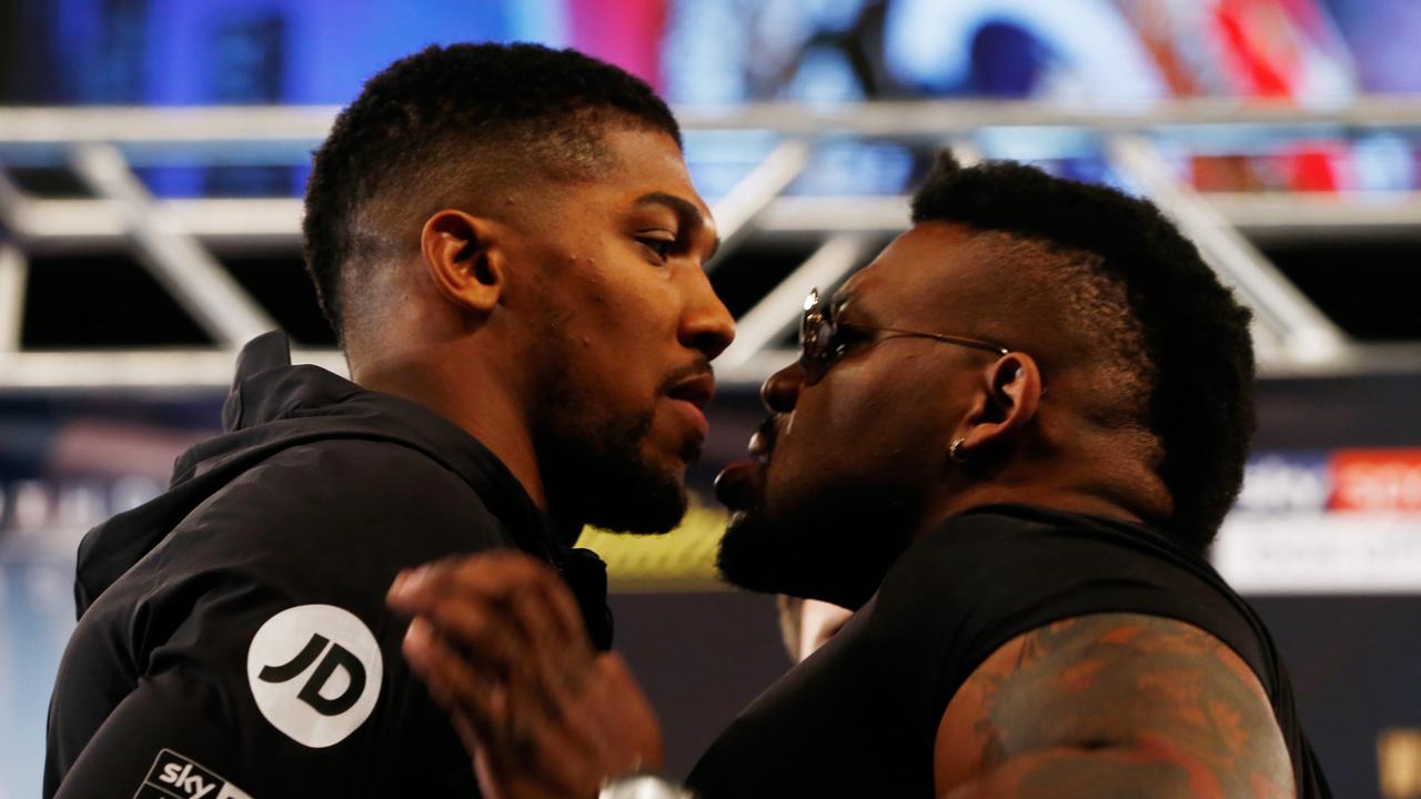 Jarrell Miller (right) pushes Anthony Joshua during a promotional face-off. (Photo by Mike Stobe/Getty Images)