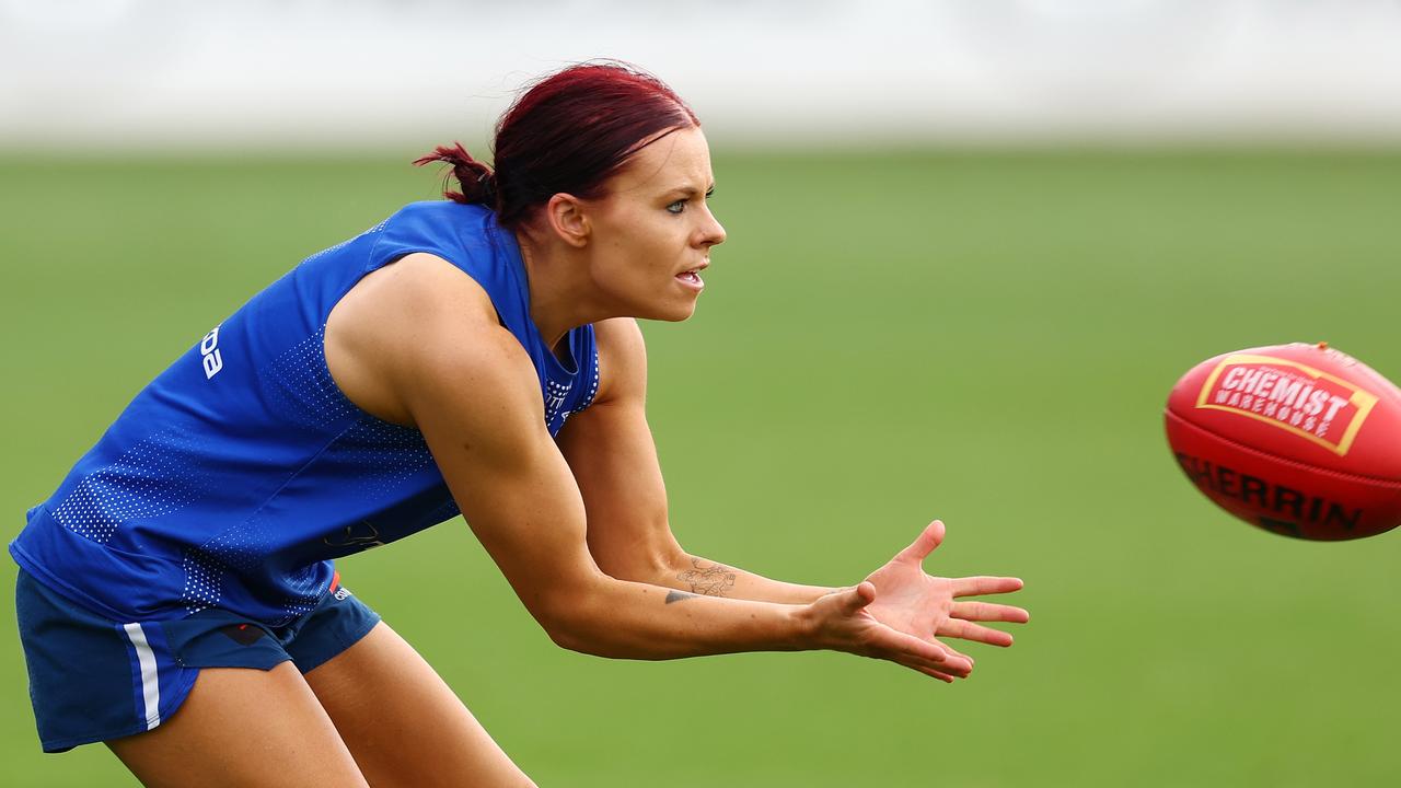 Jenna Bruton had treatment for a back issue during the Kangaroos’ training session, but returned to the track and said she would be fine for the Grand Final. Picture: Morgan Hancock / Getty Images