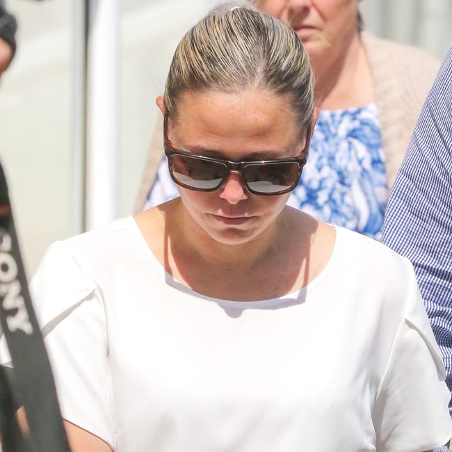 Former Tennant Creek Australia Post manager Rebecca Liebelt and her husband Greg Liebelt leaving Darwin Supreme Court on Tuesday July 26., Picture: Glenn Campbell