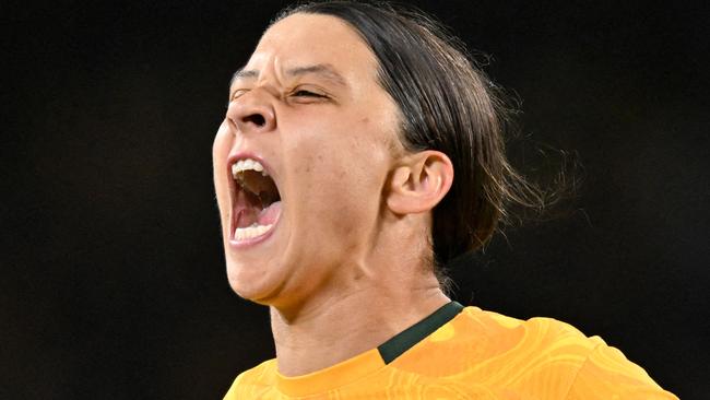 FILES-- This file photo taken on August 16, 2023 shows Australia's forward Sam Kerr celebrating scoring her team's first goal during the Australia and New Zealand 2023 Women's World Cup semi-final football match between Australia and England at Stadium Australia in Sydney. Chelsea and Australian women's football star Sam Kerr has been charged with a "racially aggravated offence" in Britain following a dispute involving a police officer, London's Metropolitan Police said March 4.  The 30-year-old striker, one of the highest profile and best-paid players in the women's game, was charged following an incident in London in January 2023, a police statement read. (Photo by IZHAR KHAN / AFP)