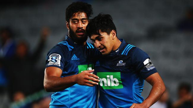 Rieko Ioane of the Blues is congratulated by his brother Akira Ioane after scoring a try.