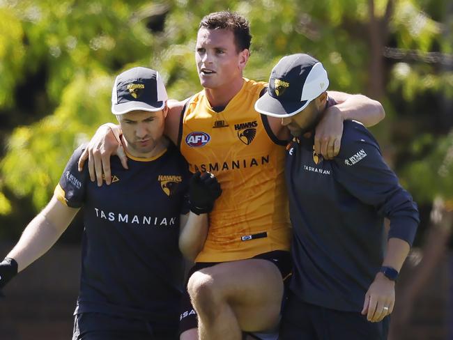 MELBOURNE , AUSTRALIA.February 15 , 2024.  AFL. Hawthorn Intraclub practise match at Waverley  Park.   James Blanck of the Hawks  is helped club staff after appearing to hurt his left knee during the clubs intra club hit out  . Pic: Michael Klein