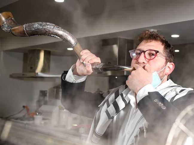 Rabbi Gabi Kaltmann at the ARK Centre in Hawthorn with Shofar and a big pot of chick peas that will be turned into hummus by the Tahini Neri team. The Ark Centre are sending food boxes and religious paraphernalia out to members of the shule so that they can celebrate Rosh Hashanah and other celebratory days where they'd normally celebrate together at Synagogue but can't due to COVID-19. PICTURE : PENNY STEPHENS. MONDAY 24TH AUGUST 2020