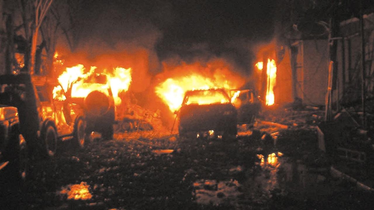 Buildings and cars are on fire after a bomb blast in tourist site of Kuta, Bali 13 October 2002. AFP PHOTO/ DARMA.