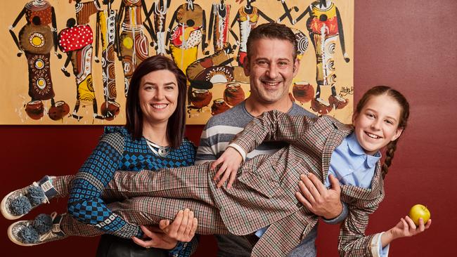 Dr Agnieszka Mierczynska-Vasilev and Professor Krasimir Vasilev with their daughter Olivia in their family home in Mawson Lakes. Picture: Matt Loxton