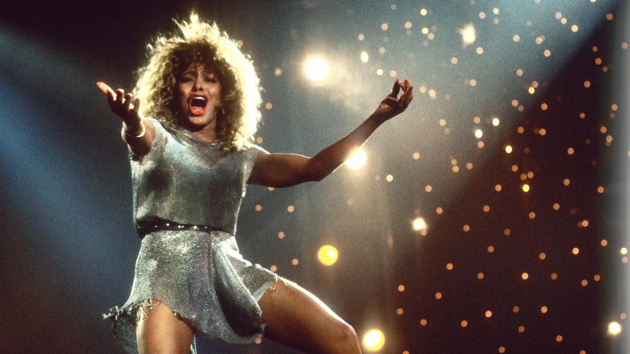 Tina Turner performs on stage in 1990. (Photo by Rob Verhorst/Redferns)