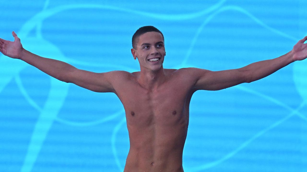 Romania's David Popovici reacts after winning and setting a new world record in the Men's 100m freestyle final event on August 13, 2022 at the LEN European Aquatics Championships in Rome. (Photo by Alberto PIZZOLI / AFP)