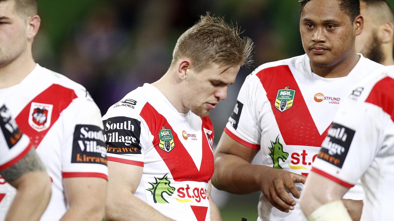 Dragons players look dejected after losing to Melbourne in Round 17.