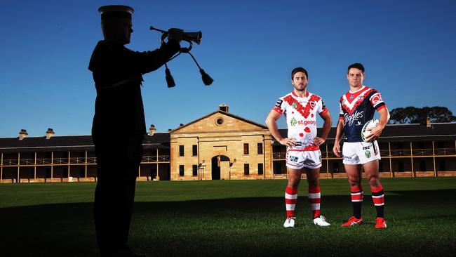 Ben Hunt and Cooper Cronk with bugler Phil O'Neill. (Phil Hillyard)