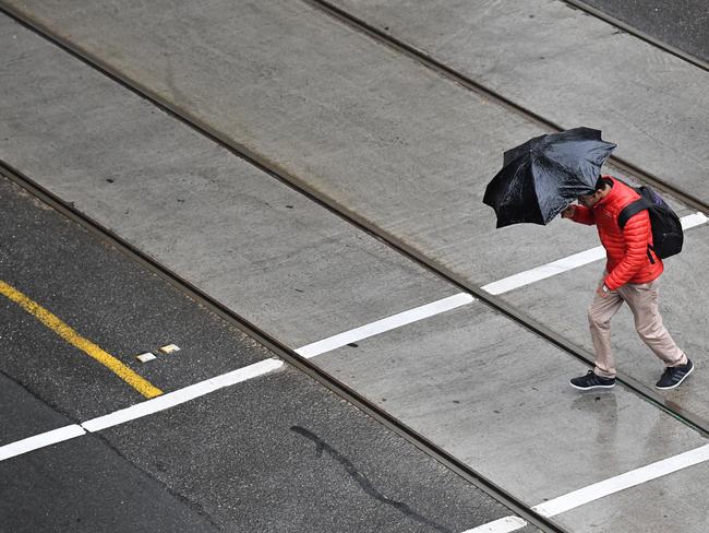 Bourke Street in Melbourne's CBD as the rain struck on Saturday. Picture: AAP Image/James Ross.