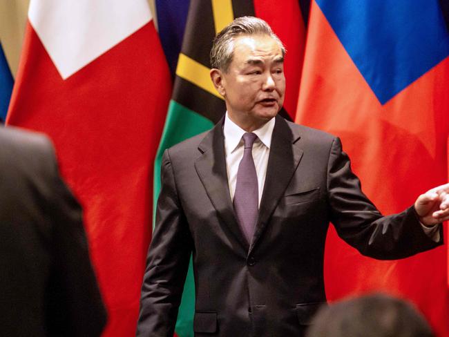 Chinese Foreign Minister Wang Yi gestures as he leaves after a joint press conference with Fijian Prime Minister Frank Bainimarama. Picture: AFP