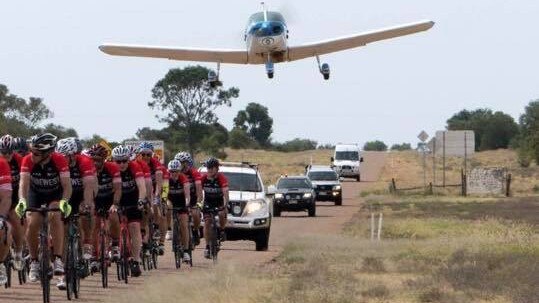 The Piper Cherokee flies over the peloton during the final leg of RideWest. Picture: supplied