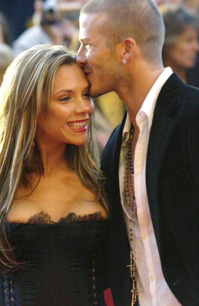 Then England captain David Beckham wasn’t shy of a PDA with his wife in 2004. Picture: News Corp Australia