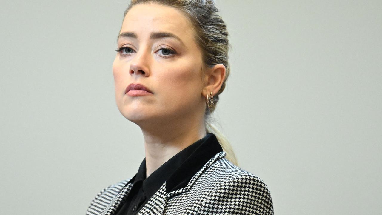 Amber Heard looks on in the courtroom. (Photo by JIM WATSON / POOL / AFP)