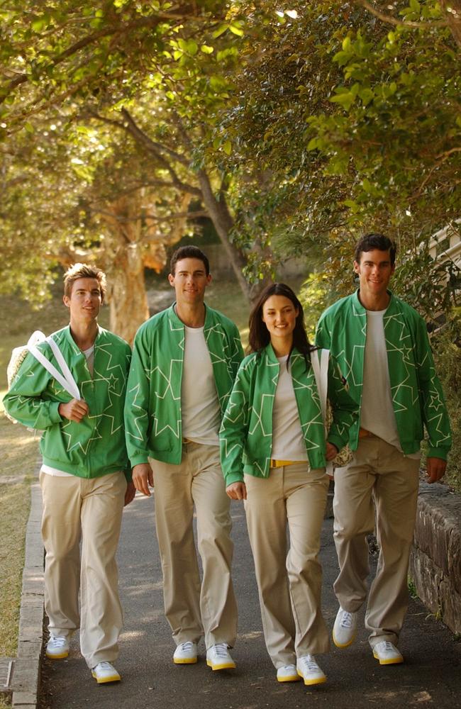 Australian Olympic rowing team members Stephen, James and Geoffrey Stewart join with model Rebecca Grey at the official uniform launch for the Athens 2004 Olympic Games. Picture: Dean Lewis/AAP