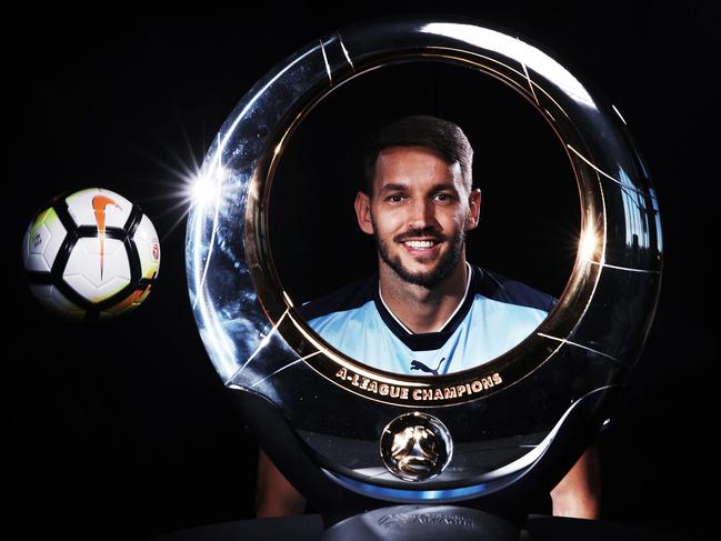 **EMBARGOED FOR OCTOBER 3rd ** - Milos Ninkovic from Sydney FC with the Hyundai A-League trophy at the media day at the Lakes Golf club in Sydney. Picture. Phil Hillyard