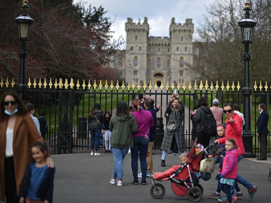 Members of the public outside Windsor Castle. They have been urged to stay away from Philip’s funeral. Picture: AFP