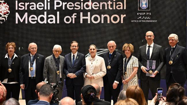 Mark Leibler and Frank Lowy, second and third from left, with Israel President Isaac Herzog, first lady Michal Herzog and other medal recipients. Picture: Haim Zach