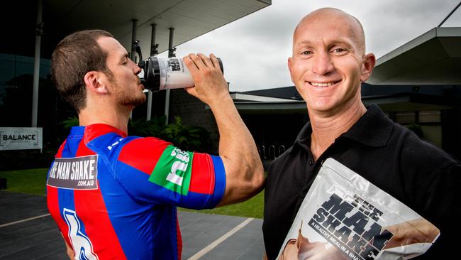 Newcastle five-eighth Jarrod Mullen with former Knight and new club sponsor Adam McDougall, owner of The Man Shake. Picture: Ryan Osland