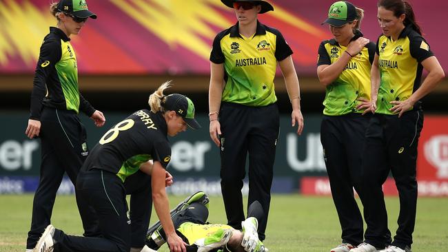 Australian players check on Alyssa Healy after her head knock. Picture: Getty Images