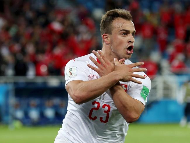 Xherdan Shaqiri celebrates scoring his team's second goal against Serbia — in a controversial manner. Pic: Getty