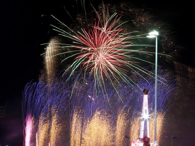 General view of the fireworks over sideshow alley at the Queensland Royal Exhibition Show, known as the EKKA, in Brisbane, Wednesday, August 16, 2017.  (AAP Image/Steve Pohlner)