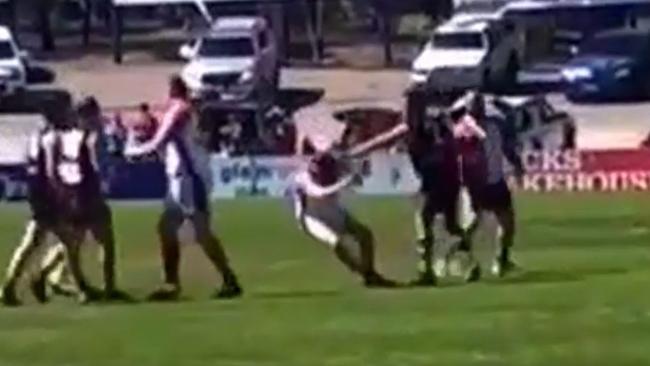 Still image of a punch during the B-Grade Southern Football League Grand Final between Christies Beach FC and Flagstaff Hill which left one man in hospital and the aggressor in prison.