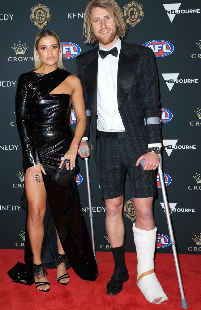 Essendon's Dyson Heppell in shorts to accommodate his leg injury — with Kate Turner. Picture: Mark Stewart