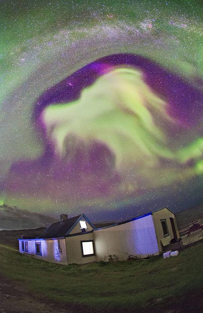 A view of the northern lights that look like a dragon's head above Tasiusaq farm in Greenland. Picture: Juan Carlos Casado 