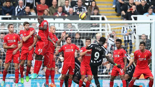 Newcastle United's Senegalese striker Papiss Cisse takes a free kick.