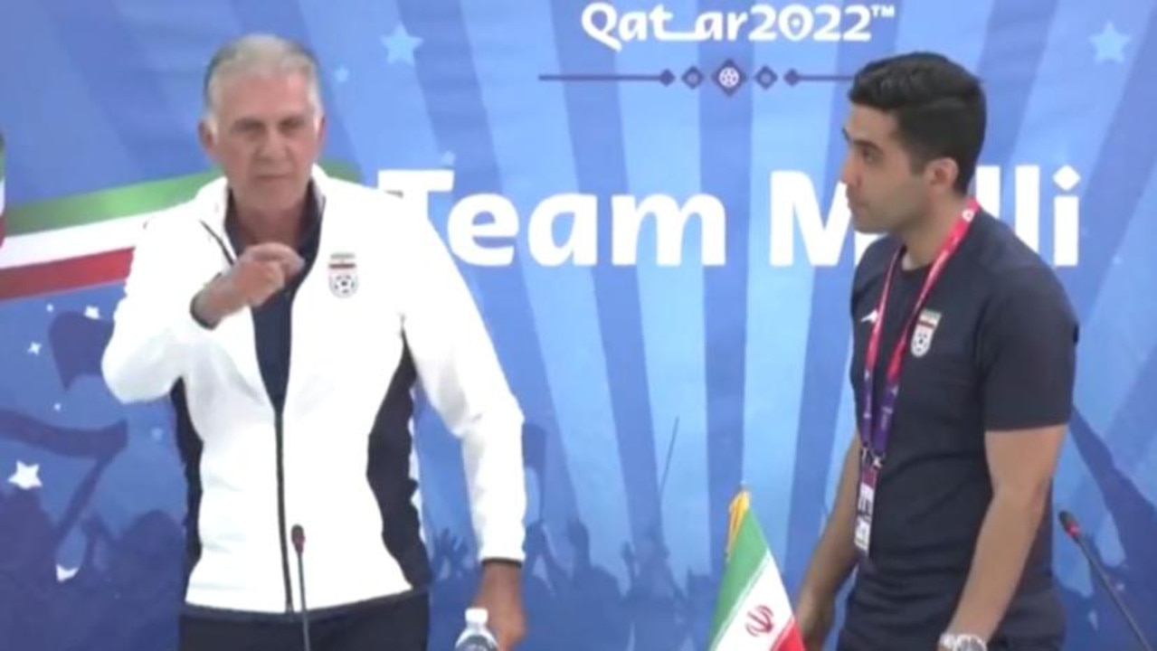 Iran's coach storms out of a press conference.