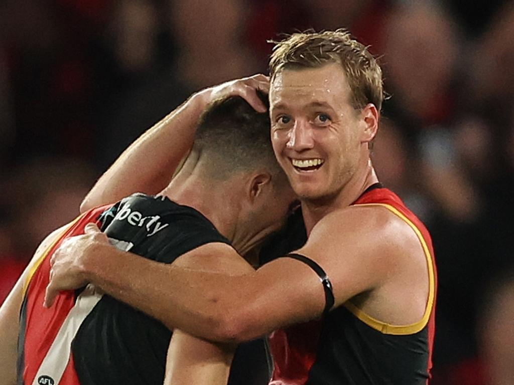 MELBOURNE, AUSTRALIA – MAY 11: Zach Merrett and Darcy Parish of the Bombers after the Bombers defeated the Giants during the round nine AFL match between Essendon Bombers and Greater Western Sydney Giants at Marvel Stadium, on May 11, 2024, in Melbourne, Australia. (Photo by Robert Cianflone/Getty Images)