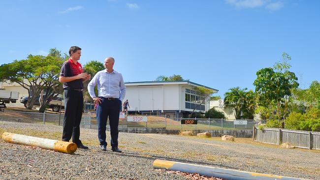 Principal Michael Hurst and Member for Gladstone Glenn Butcher discuss funding to upgrade the "unofficial" carpark at Boyne Island State School.