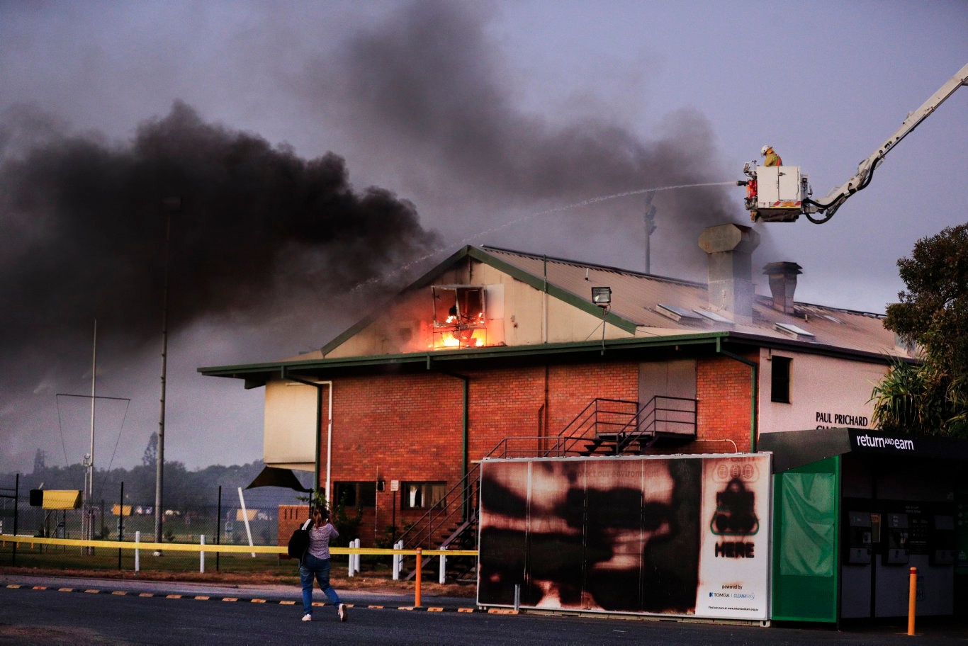 Flames burst from the roof of the Cudgen Leagues club as Queensland Fire Brigade Officers assist local Kingscliff and Tweed Units to fight the fire .Photo Scott Powick Newscorp