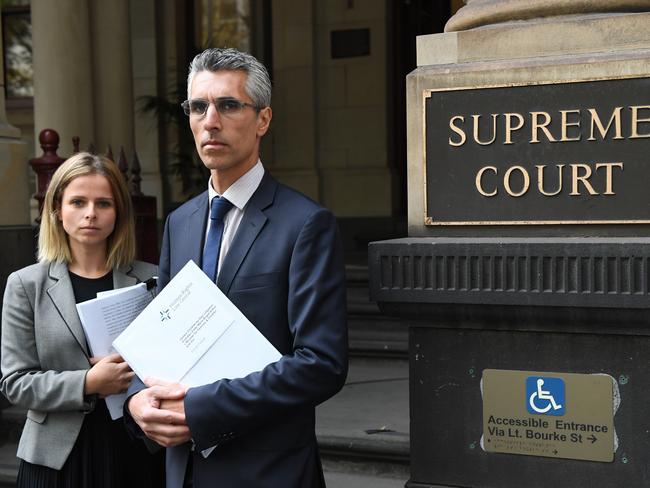 Alina Leikin and Hugh de Kretser from the Human Rights Centre outside the Supreme Court in Melbourne. Picture: AAP Image/Julian Smith